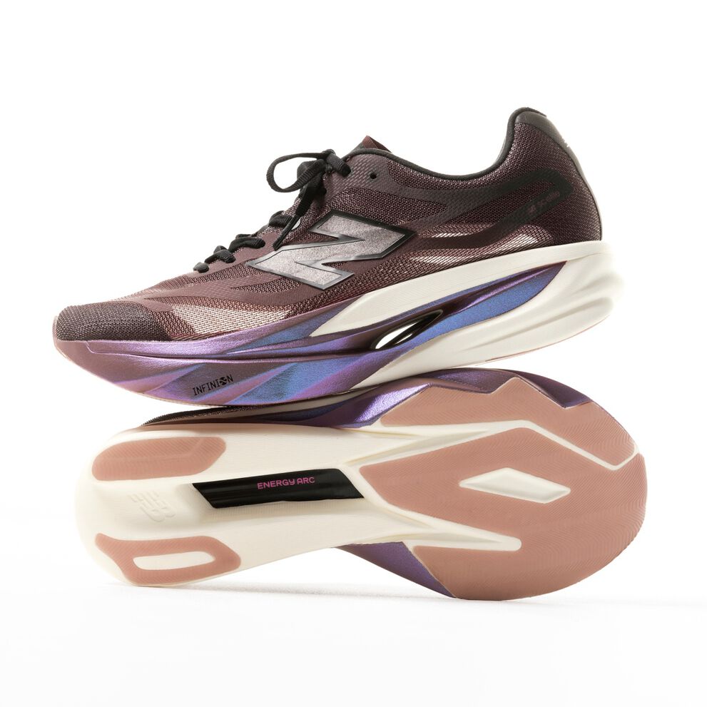 Running shoe in purple and cream colorway displayed in a studio product shot showing both the side profile and outsole.